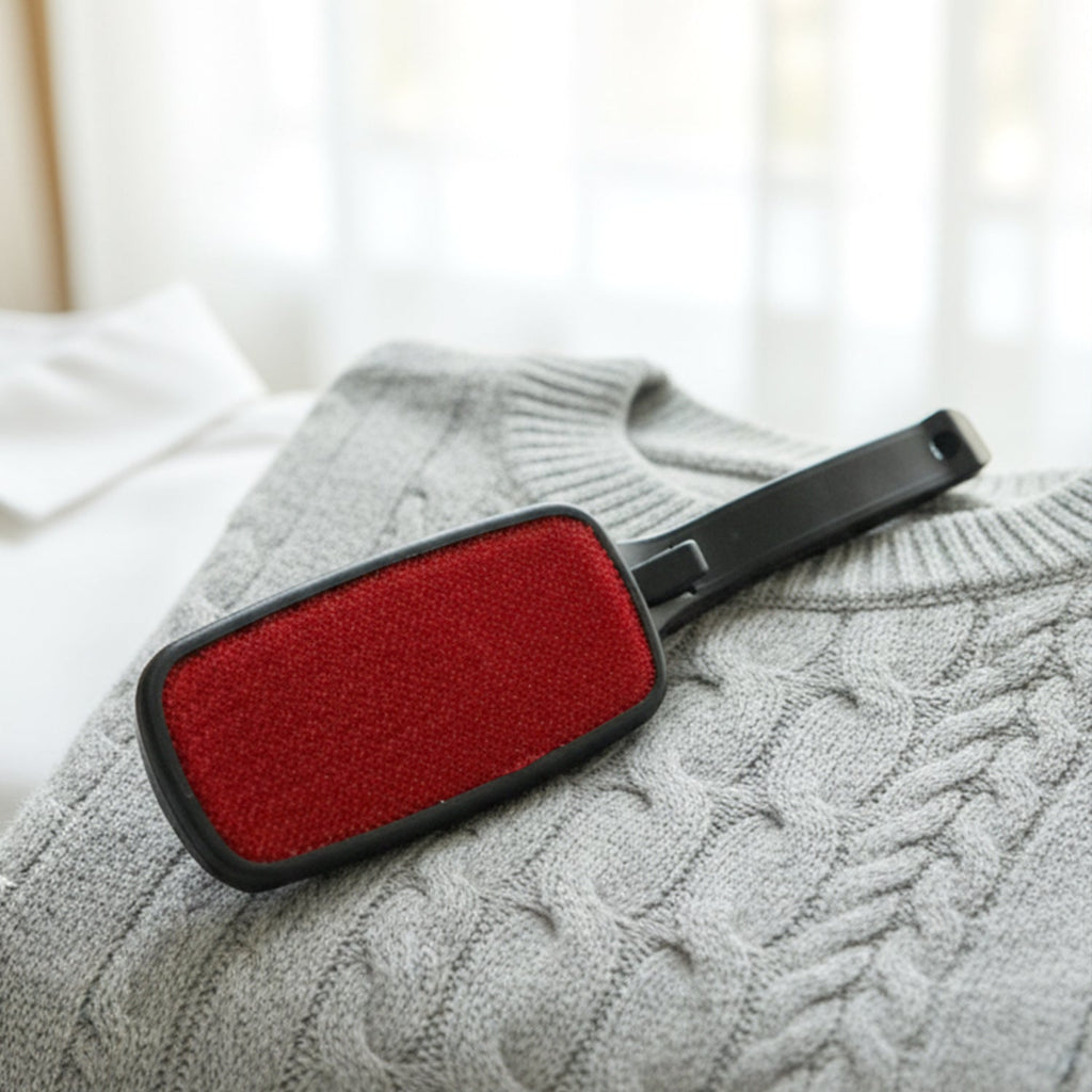 Dust removal brush for clothes and upholstery with ergonomic handle