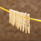 Eco-friendly bamboo cloth clips neatly displayed, highlighting their sustainable material.