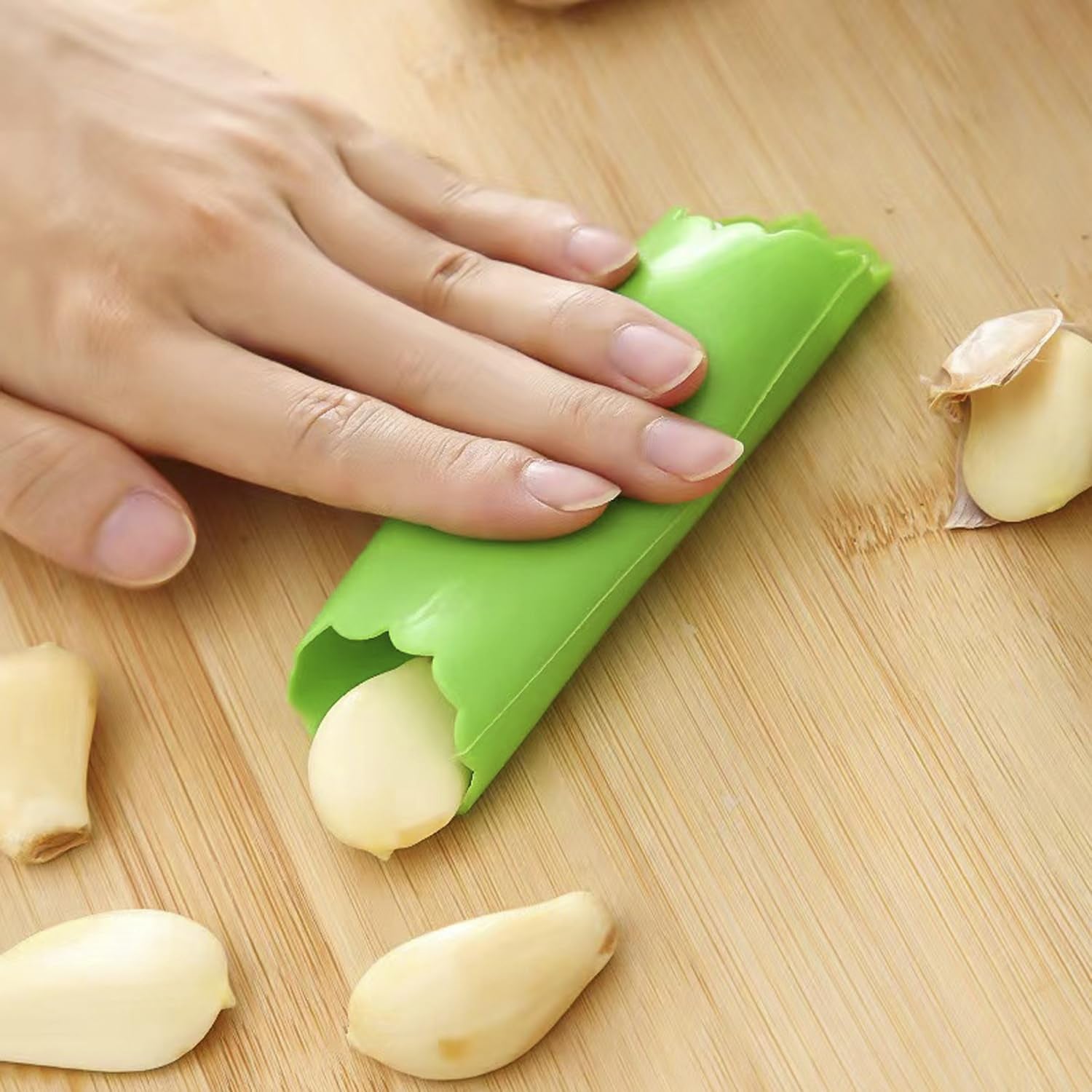 Garlic peeler tube rolled with garlic cloves inside