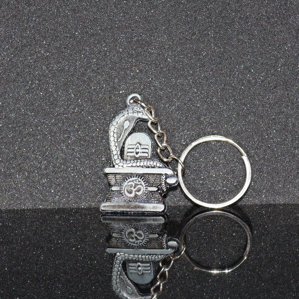 Elegant Shivling keychain with snake design in silver metal