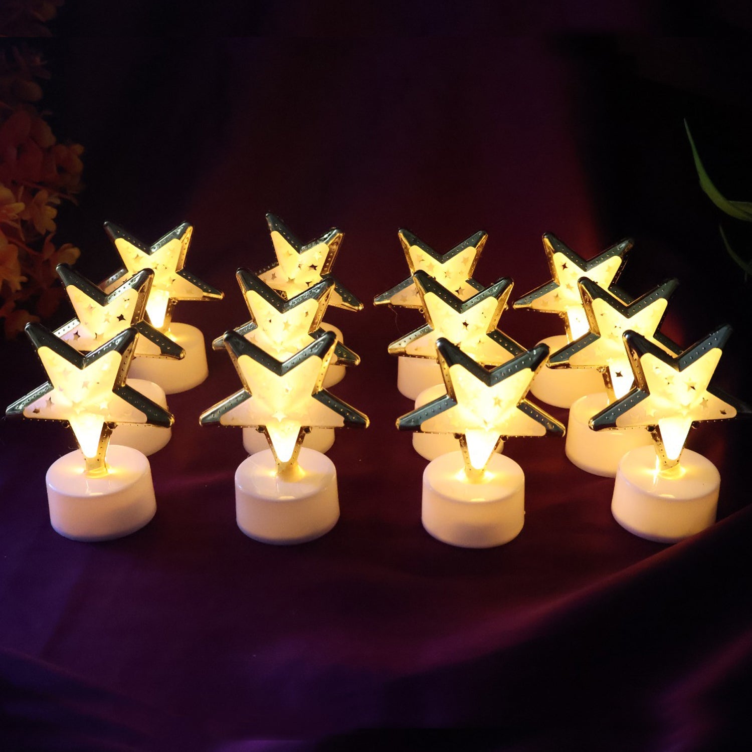 Golden outlined star shaped LED candle providing warm light without flame
