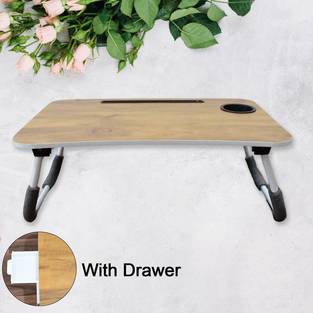foldable laptop table used for studying with books and a tablet, highlighting its versatility.