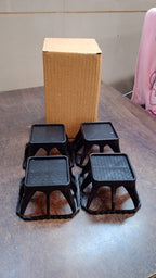 Plastic washing machine stand set placed in laundry room for appliance elevation
