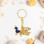 Decorative Krishna keychain featuring peacock motif with enamel detailing