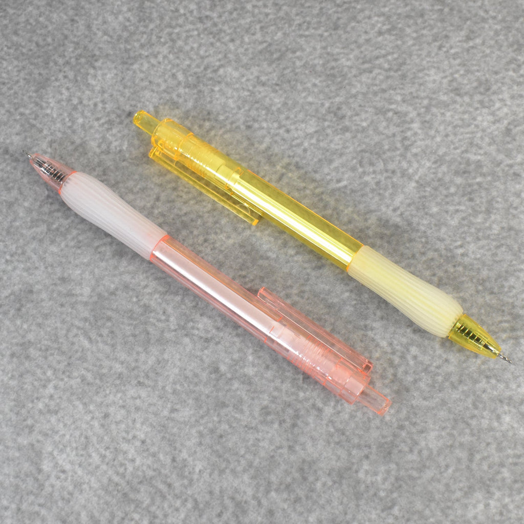 A pair of CustoPen ballpoint pens displayed with essential office stationery.