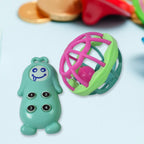 Joyful infant reaching for a colorful rattle, encouraging hand-eye coordination