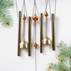 Lord Ganesh Wind Chimes displayed in garden setting creating peaceful ambiance