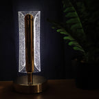 Golden crystal table lamp glowing warmly in living room decor