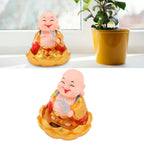 Side view of the solar-powered Buddha figurine, designed for automatic movement.