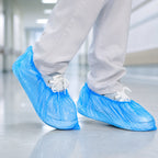 Various lightweight blue disposable shoe covers displayed.