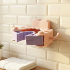 Installation of wall mounted holder clip demonstrated with adhesive