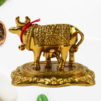 Golden Kamdhenu Cow metal statue symbolizing prosperity