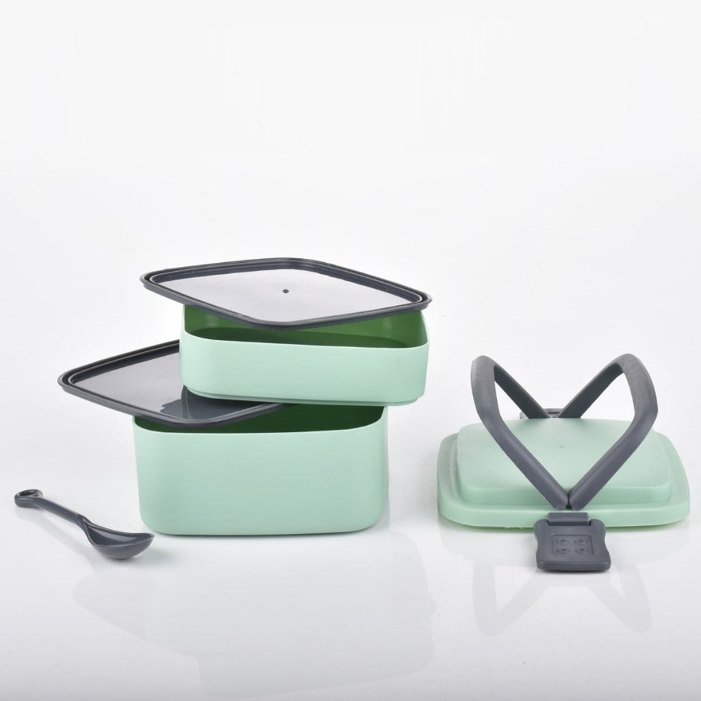 Green plastic bento box with a secure locking system.