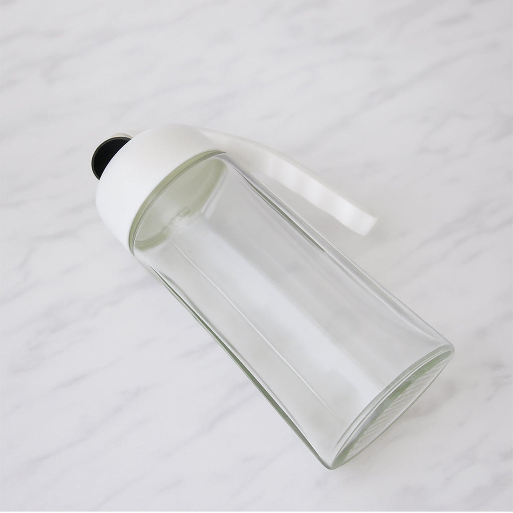 Automatic lid mechanism opening on glass oil bottle dispenser