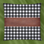 Stylish leather and cotton cushion covers adding a chic accent to a bedroom setting.