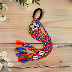 Festive braided hair accessory with elastic band and colorful tassels