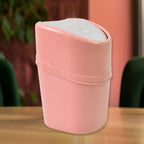 Close-up of the durable plastic swing lid mechanism on the mini dustbin.
