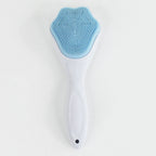 Silicone face scrubber displayed with other skincare products for a complete routine.