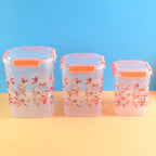 Airtight Food Storage Set with square floral containers in three sizes.