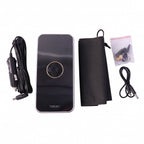 Black portable air pump on white background with accessories