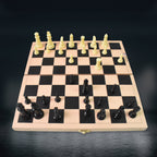 Detail of the wooden chess board's smooth surface and inlaid squares.