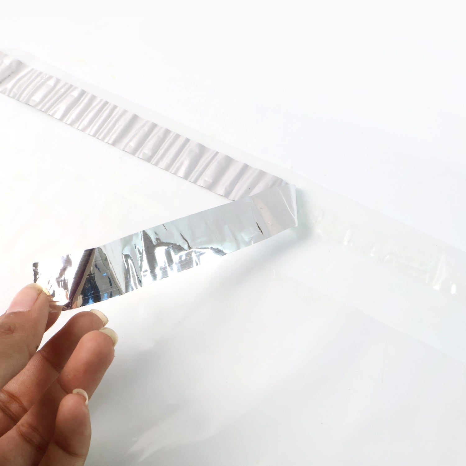 Stack of self-adhesive courier polybags 12x14 inch