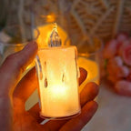 Hand holding a smokeless, odourless LED candle, perfect for safe home decor.
