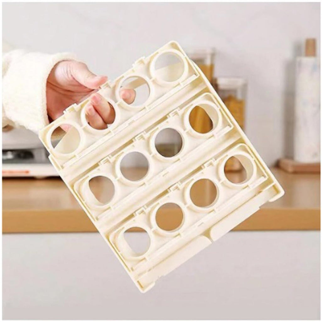 Hand opening the upper layer of the foldable egg tray to access eggs.