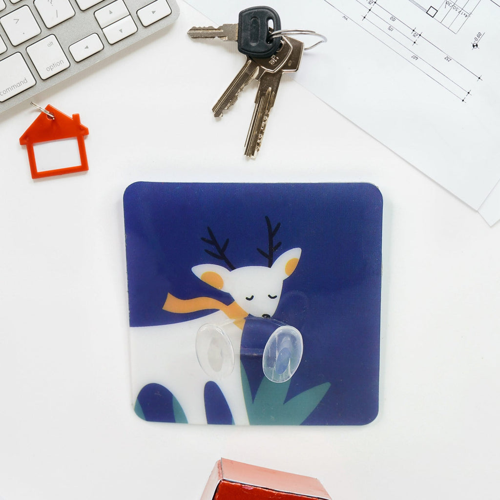 Waterproof self-adhesive wall hook mounted on a tiled bathroom wall.