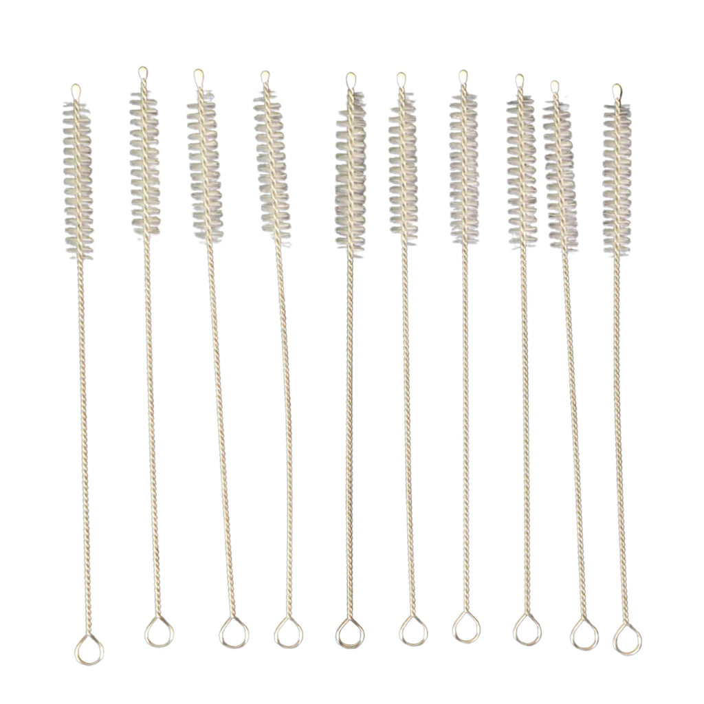 Nylon bristles cleaning a reusable metal straw with the brush from the set