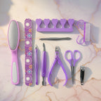 Stainless steel manicure and pedicure tools arranged neatly in the grooming set