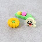 A green pea pod shaped cartoon eraser, designed for a comfortable grip and effective erasing.