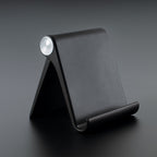 Foldable mobile stand showing adjustable angle on a study table