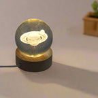 Overhead view of the astronaut crystal lamp with its elegant wooden stand.
