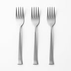 Detailed close-up of the tines of a durable stainless steel dinner fork.