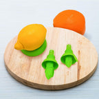 A compact citrus sprayer effortlessly misting juice from a fresh lemon.
