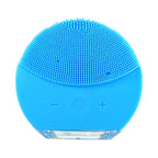 Facial cleansing brush glowing to show sonic technology in use