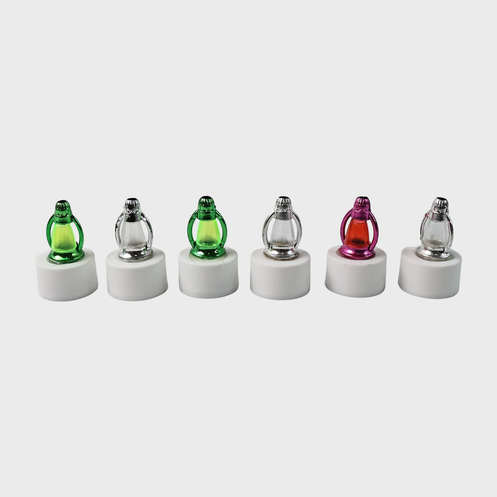 Battery-operated LED candle lights with decorative lantern-style covers