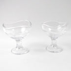 Clear glass dessert bowl highlighting its sturdy footed base.