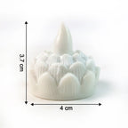 Decorative lotus designed LED tealight candles glowing warmly in dark