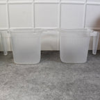 Overhead view of the robust plastic mugs, showcasing their wide opening for easy cleaning.