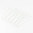 Stack of 6 white plastic clothes hangers ready for use