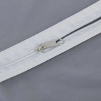 Closeup of durable full-length zipper on the breathable fabric suit cover.