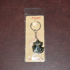 Ganesh Face Antique Black Metal Keychain placed on plain background for clear visibility