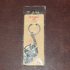 Metal keychain displaying detailed craftsmanship of Trishul and Damru symbols