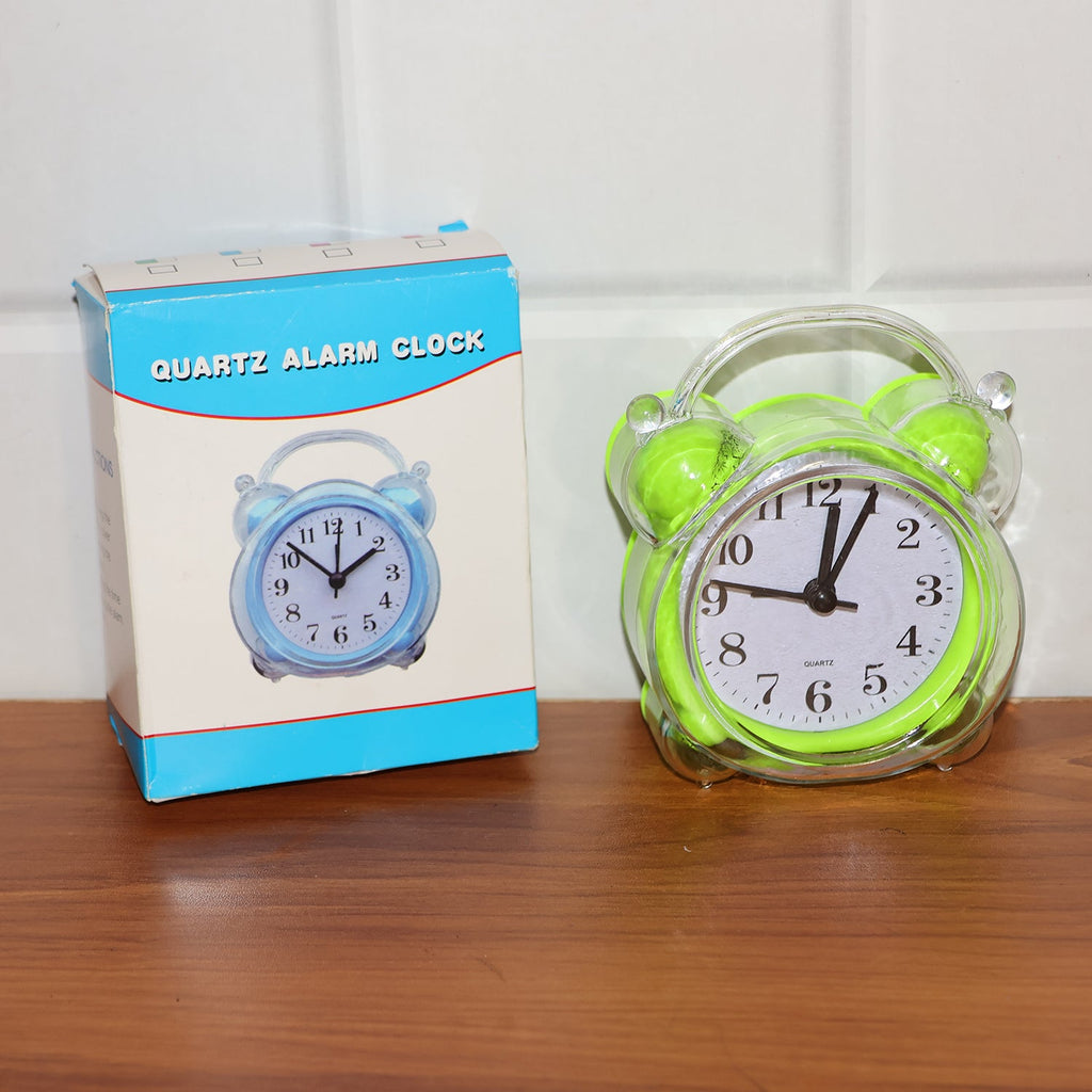 Portable compact quartz analog alarm clock in green transparent frame