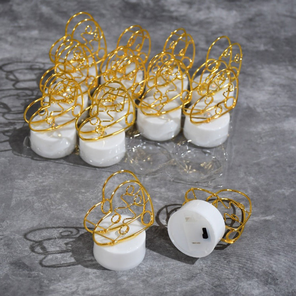 Multicolor flameless heart candles scattered on a surface, ideal for creating a festive or romantic setting.