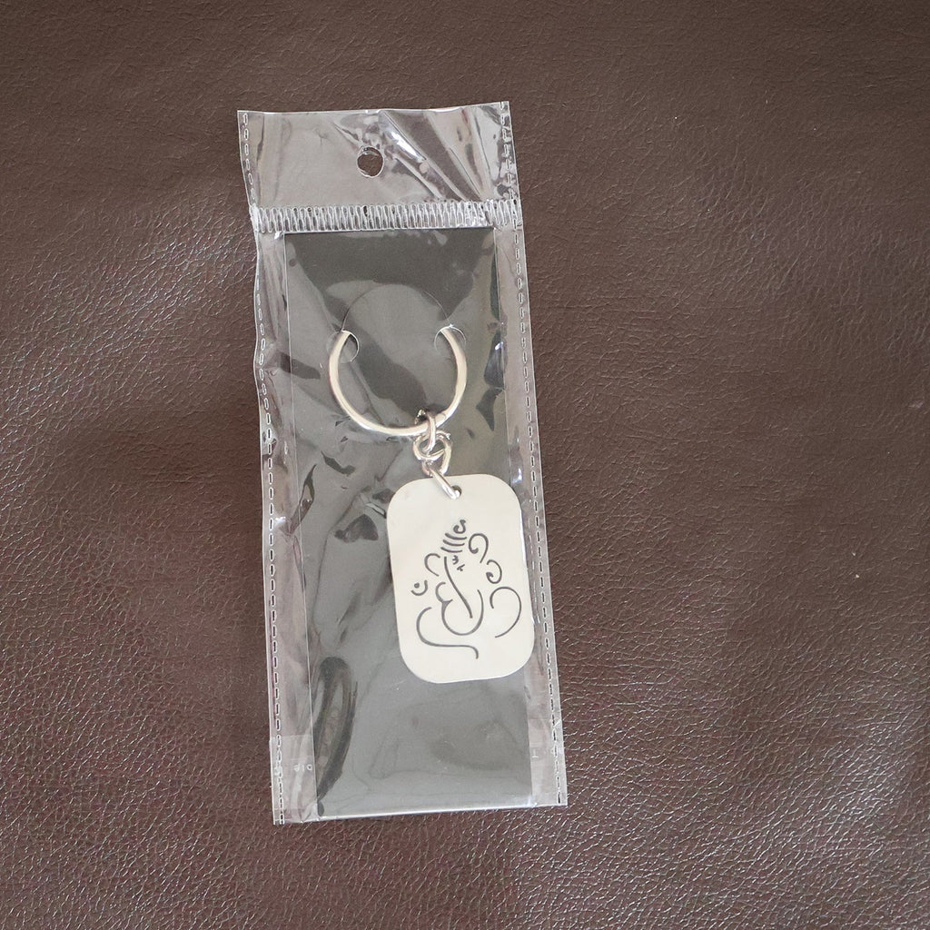 Back view of the Ganesh Metal Keychain, showing its smooth edges and premium finish.