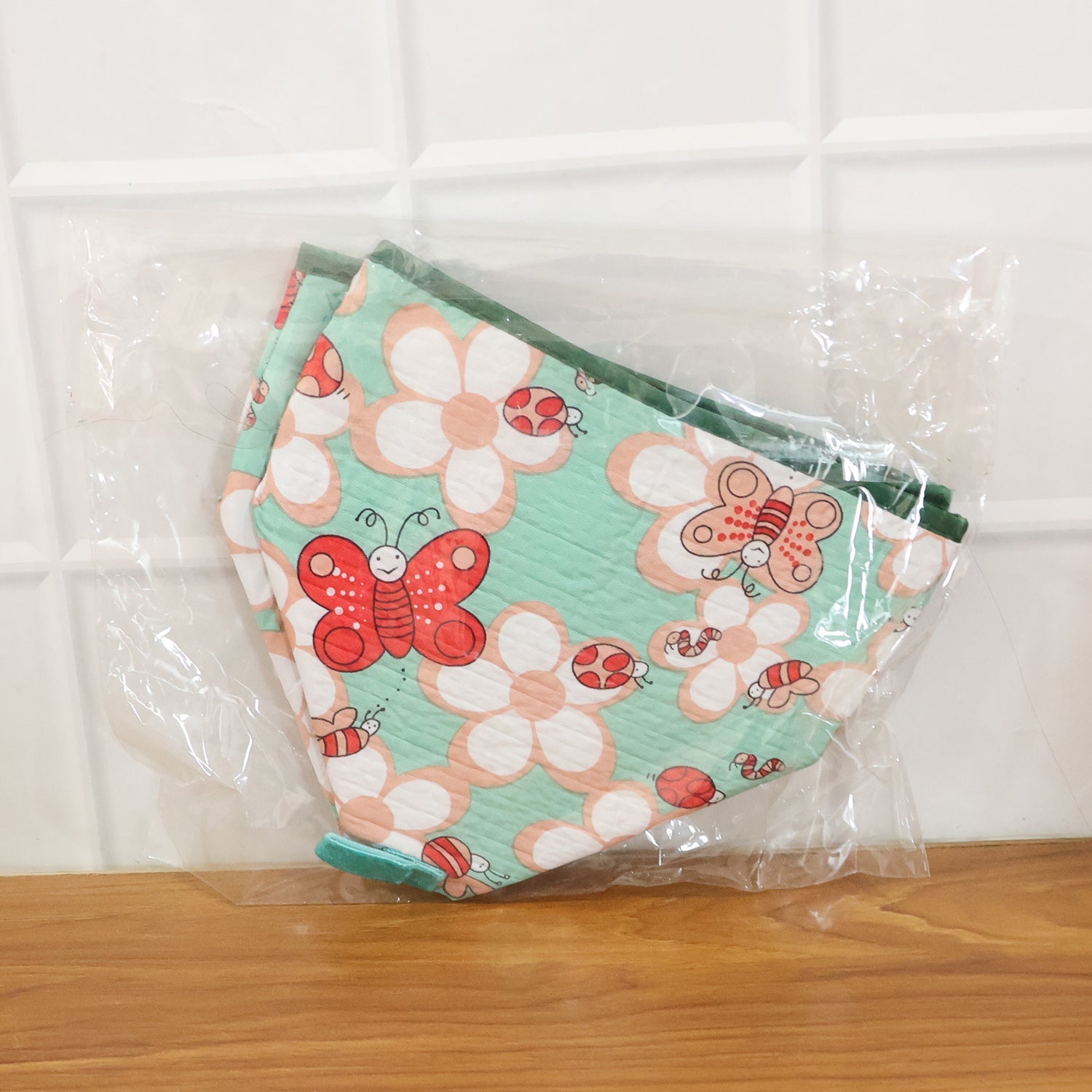 Compact collapsible food cover with decorative butterfly print