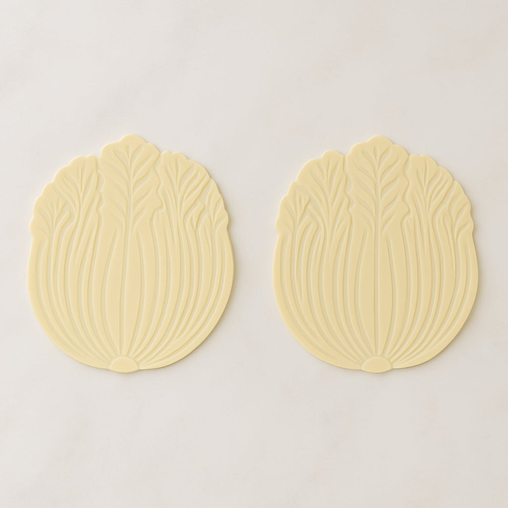 Silicone leaf coaster protecting surface from heat and moisture with hot beverage
